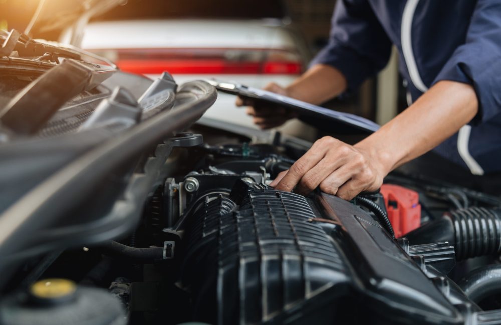Automobile mechanic repairman hands repairing a car engine automotive workshop with a wrench, car service and maintenance,Repair service.
